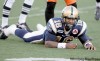TREVOR HAGAN / WINNIPEG FREE PRESS
Blue Bombers quarterback Michael Bishop watches the end of the play from ground level after taking a hit from the B.C. Lions' defence during Winnipeg's 24-21 defeat Sunday at Canad Inns Stadium.