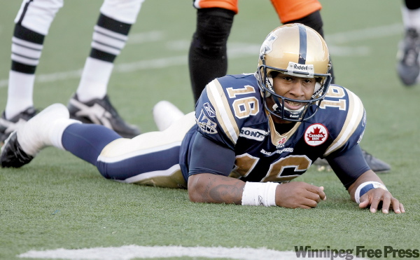 TREVOR HAGAN / WINNIPEG FREE PRESS
Blue Bombers quarterback Michael Bishop watches the end of the play from ground level after taking a hit from the B.C. Lions' defence during Winnipeg's 24-21 defeat Sunday at Canad Inns Stadium.