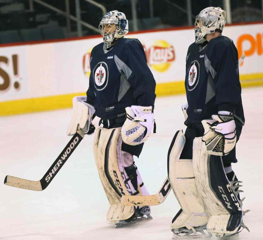 JOE BRYKSA / WINNIPEG FREE PRESS
Winnipeg Jets Ondrej Pavelec, left, chats with goaltender Connor Hellebuyck during practice Wednesday.