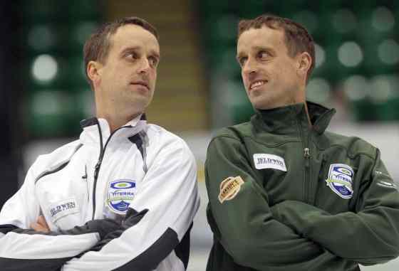 JOE BRYKSA / WINNIPEG FREE PRESSIdentical twins Dennis ( Assiniboine Memorial) and David Bohn (Granite Curling Club), right, are both skips for separate teams at the Manitoba Men's Curling Championship at Selkirk Recreational Complex.