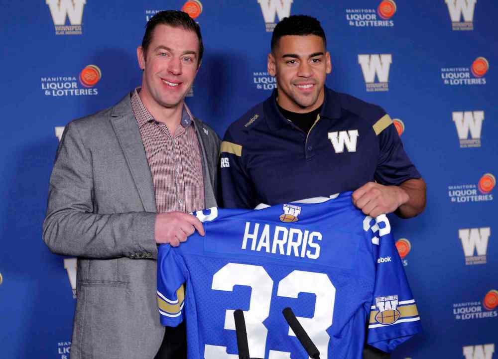 BORIS MINKEVICH / WINNIPEG FREE PRESS files
Bombers have been busy in free agency, adding running backs Andrew Harris (pictured with Bombers general manager Kyle Walters) and Pascal Lochard, receivers Weston Dressler and Ryan Smith, defensive tackles Keith Shologan and Euclid Cummings, offensive lineman Jeff Keeping and kicker Justin Medlock.
