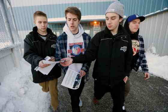 JOHN WOODS / WINNIPEG FREE PRESSKris Hrom (from left) hands 