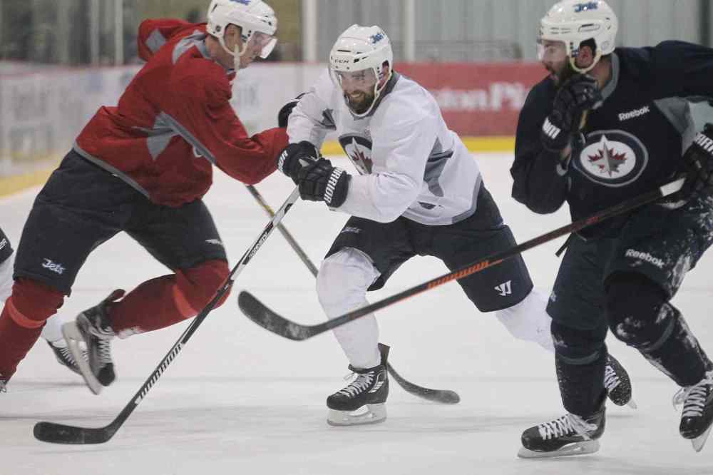 MIKE DEAL / WINNIPEG FREE PRESS
Winnipeg Jets winger Andrew Ladd doesn't know where he'll be next week, but he was still working hard during practice at the MTS Iceplex Monday morning.