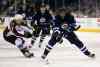 TREVOR HAGAN / WINNIPEG FREE PRESS
Winnipeg Jets' Dustin Byfuglien (33) carries the puck past Colorado Avalanche's John Mitchell (7) scored during the second period.