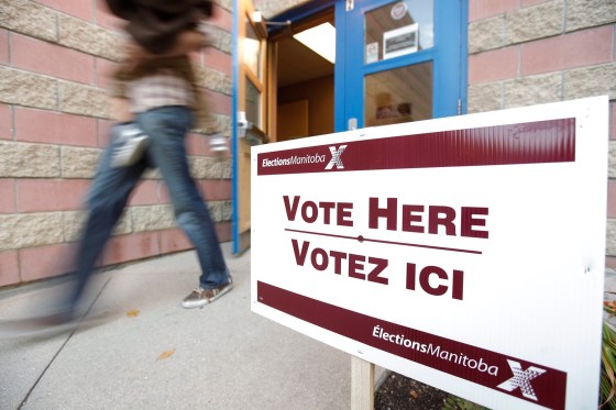 FileA voter walks out of a polling station in Winnipeg after voting in the October 2011 Manitoba election.