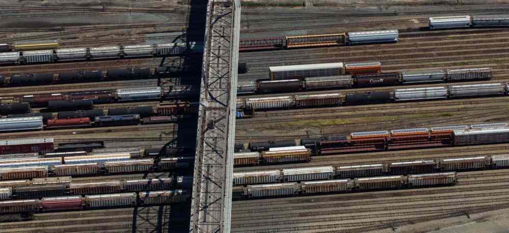 The shadow of the Arlington Bridge falls on the CP Rail yards in 2016. (Mike Deal / Winnipeg Free Press)