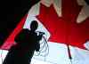 RUTH BONNEVILLE / WINNIPEG FREE PRESS  
 Sound technician Matt Boyer with Sound Art sets up a microphone on stage at the Lyric Thursday afternoon in preparation for Canada Day celebrations.