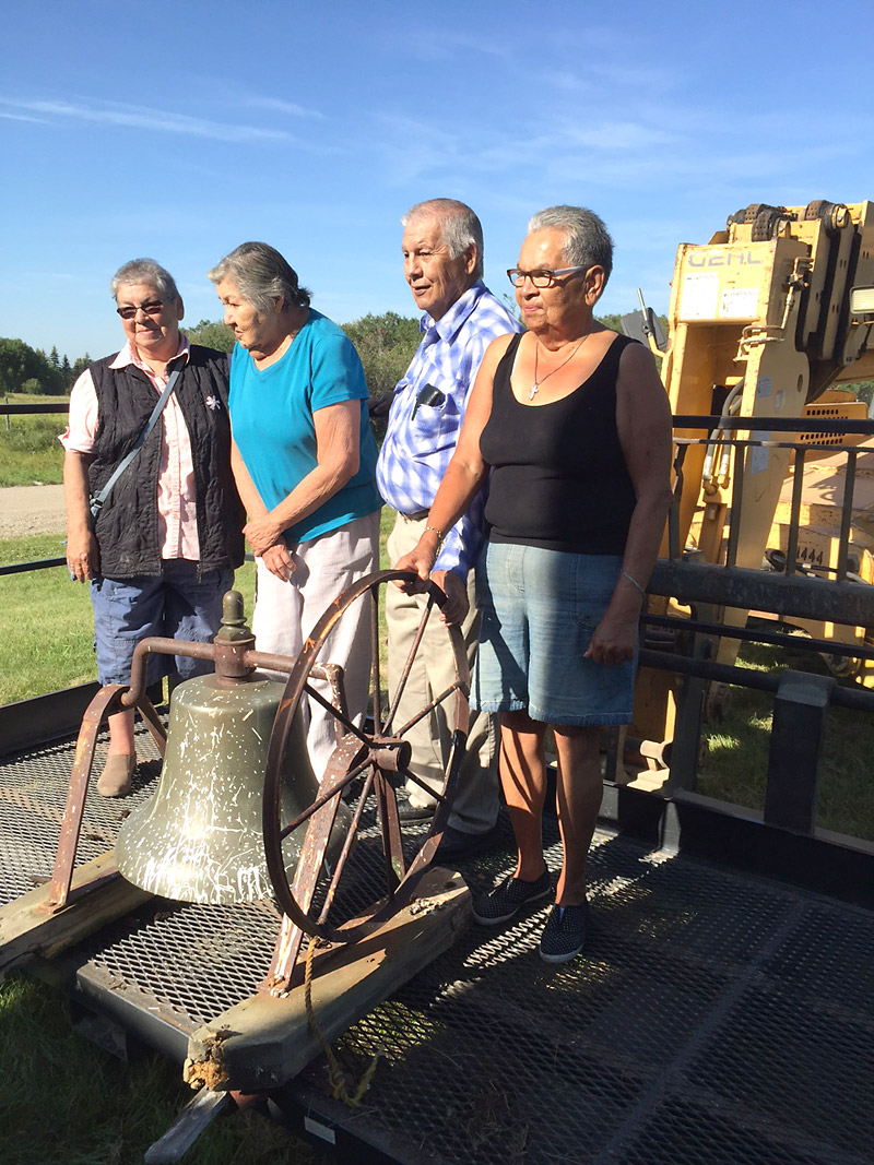 Supplied
Community elders pose with the bell from St. Huberts Catholic church on Gambler First Nation on Friday.