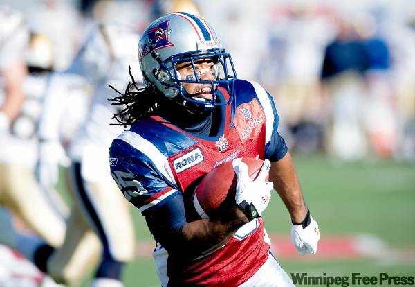 GRAHAM HUGHES / THE CANADIAN PRESS
Montreal Alouettes kick returner Larry Taylor breaks another one against the Winnipeg Blue Bombers Sunday at Molson Stadium.
