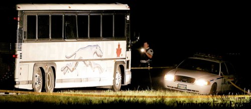 CANADIAN PRESS FILE PHOTO 
RCMP officers outside Bus 1170 near Portage la Prairie on the fateful morning in July 2008.