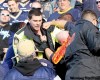 RAY PETERS / FOR THE WINNIPEG FREE PRESS
A Winnipeg police officer is punched while he and another officer try to remove a drunken fan during Sunday's game at the stadium.