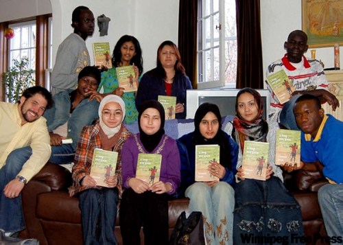 SUPPLIED PHOTO
Kuly (front left) and his Gordon Bell students with their copies of Ishmael Beah's A Long Way Gone.