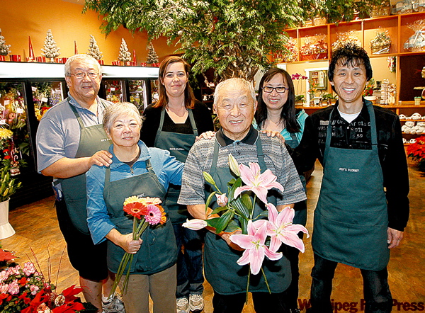 BORIS.MINKEVICH@FREEPRESS.MB.CA
Roy's Florist is back in business after a fire earlier this year. Celebrating the opening are (from left to right back) David Nishimura, Terri Holroyd, Cathy Kaita and Michael Kaita. Lily and Ron Kaita are holding flowers in front row.