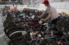 JEN DOERKSEN / WINNIPEG FREE PRESS FILES
City of Winnipeg employees prepare for the annual bike auction at East End Arena & Community Club last April.
