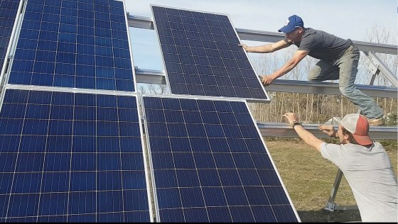 Solar Manitoba employees work at installing solar panels. (Submitted)