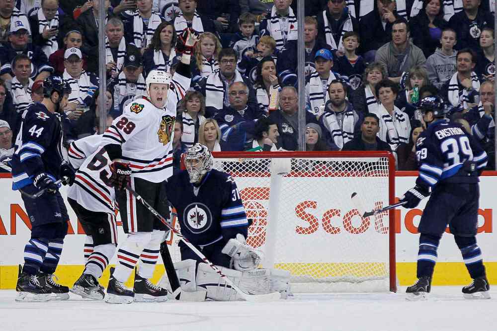 John Woods / The Canadian Press
Chicago Blackhawks' Bryan Bickell (29) celebrates Nick Leddy's (8) goal against the Winnipeg Jets during the second period.