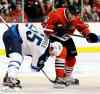 NAM Y. HUH / THE ASSOCIATED PRESS 
Chicago’s Marcus Kruger and Winnipeg’s Mark Scheifele battle for the puck during second-period action at the United Center Wednesday night.
