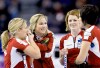NATHAN DENETTE / THE CANADIAN PRESS
Team Jones, from left, Cathy Over­ton- Clapham, skip Jennifer Jones, Dawn Askin and Jill Officer confer while playing against Team Webster Tuesday: ‘...There’s no sense in giving up and not enjoying ourselves.’
