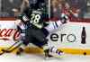 MARLIN LEVISON / MINNEAPOLIS STAR TRIBUNE / MCT
Zenon Konopka of the Minnesota Wild and Chris Thorburn of the Winnipeg Jets mix it up during first-period action at the Xcel Energy Center Sunday.