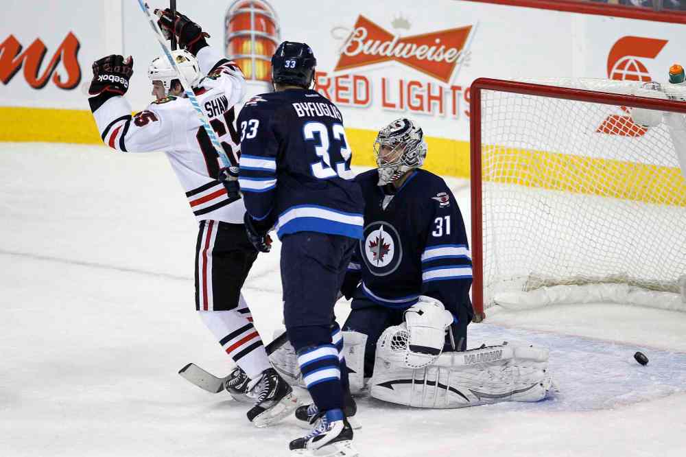 John Woods / Canadian Press archives
Dustin Byfuglien did not practice this morning after getting banged up in last night's game against Chicago.
