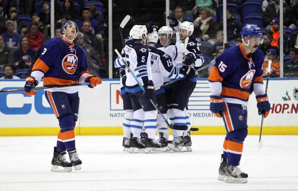 Brad Penner / USA TODAY Sports
The Jets celebrate a goal during the second period.