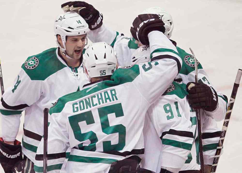 JOHN WOODS / THE CANADIAN PRESS
Dallas Stars (from left) Jamie Benn, Sergei Gonchar, Valeri Nichushkin and Tyler Seguin celebrate Seguin's first-period goal.