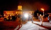 RUTH.BONNEVILLE@FREEPRESS.MB.CA
Torchbearer Errol McKay makes his way to the Manitoba Legislative Building from Memorial Boulevard Tuesday evening before the torch moved on to The Forks.