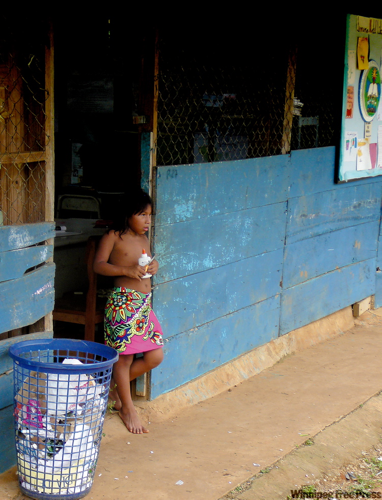 Canwest News Service
An Embera girl steps out of the one-room classroom in her village in Chagres National Park. The children are taught grades 1 through 6 in the village and then often go on to high school, taking a dugout canoe to a nearby community.