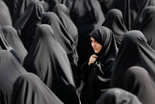 HASAN SARBAKHSHIAN / The Candian Press files
Iranian women attend a funeral ceremony for the remains of the bodies of unidentified Iranian soldiers killed during the Iran-Iraq War of 1980-88, in Tehran, Iran on Monday Feb. 16, 2009.
