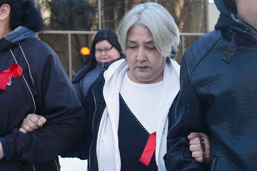JOHN WOODS / WINNIPEG FREE PRESS
Thelma Favel, Tina Fontaine's aunt, leaves the Law Courts building with family members after the first day of testimony in the murder trial of Raymond Cormier, Fontaine's alleged killer, in Winnipeg, Monday.