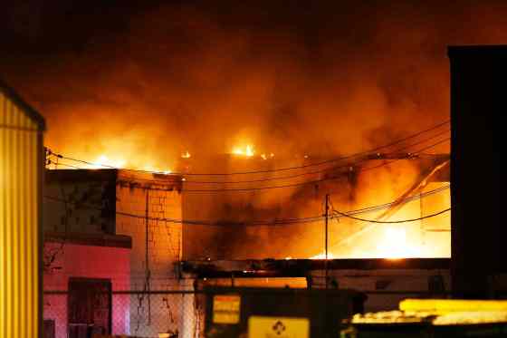 JOHN WOODS / WINNIPEG FREE PRESSFirefighters were no longer trying to save the two-storey building on Roseberry Street Monday evening and were in a defensive mode to prevent it from spreading.