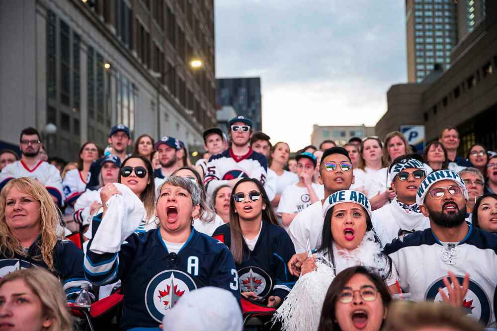 MIKAELA MACKENZIE / WINNIPEG FREE PRESS
Jets fans react to a tense game at the whiteout street party in Winnipeg on Monday, May 7, 2018.
Mikaela MacKenzie / Winnipeg Free Press 2018.