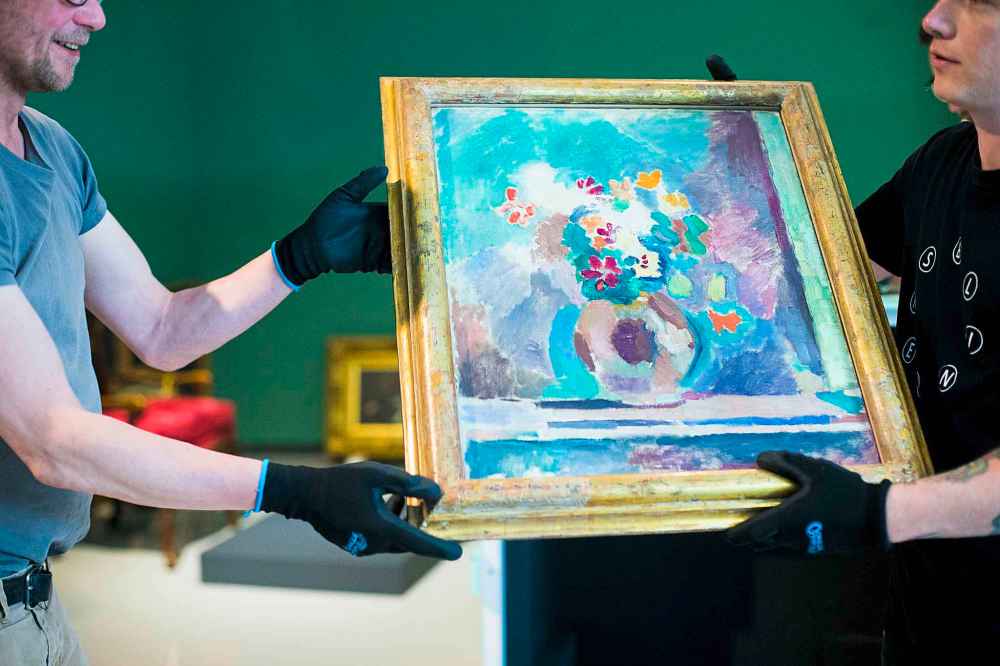 Staff at the Winnipeg Art Gallery uncrate Henri Matisse's Flowers.