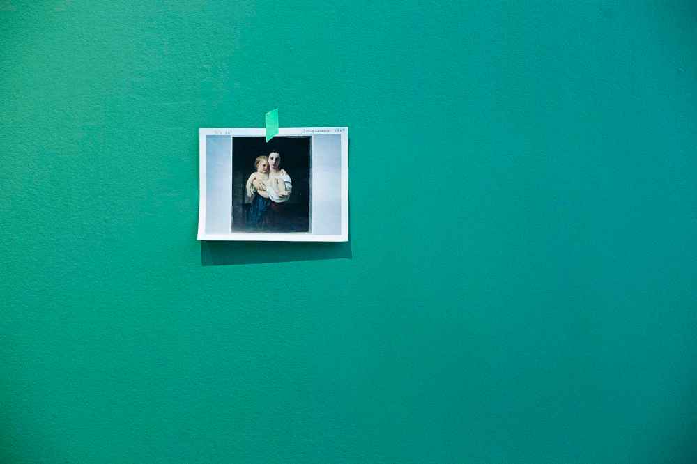 A photograph marks the spot where a work of art will hang as the exhibit is set up.