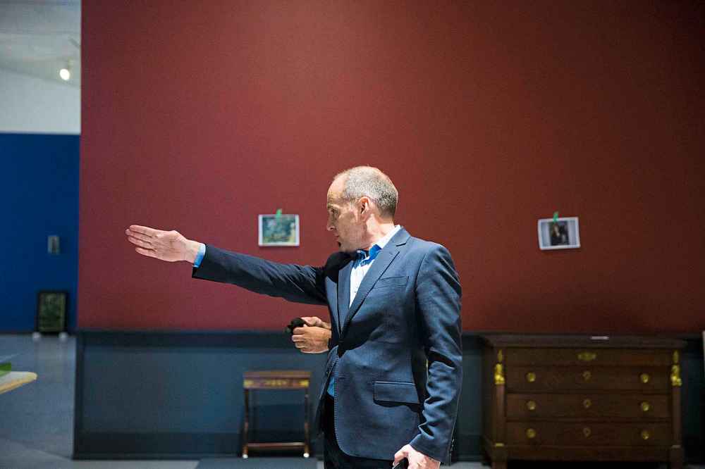 Stephen Borys tweaks the setup of the Summer with the Impressionists exhibit.