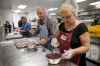 Mike Deal / Winnipeg Free Press
Volunteers Biagio DeDominicis (left) and Mavis Swedlo (right) prepare the cranberry sauce.