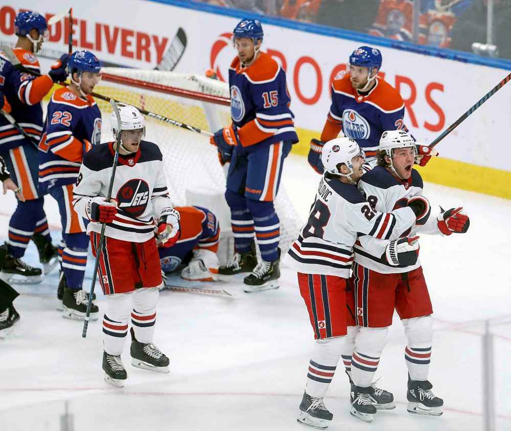 TREVOR HAGAN / WINNIPEG FREE PRESS
Winnipeg Jets' Andrew Copp (9), Jack Roslovic (28) and Brendan Lemieux (48) celebrate after Lemieux scored on Edmonton Oilers' goaltender Mikko Koskinen (19) during the second period.