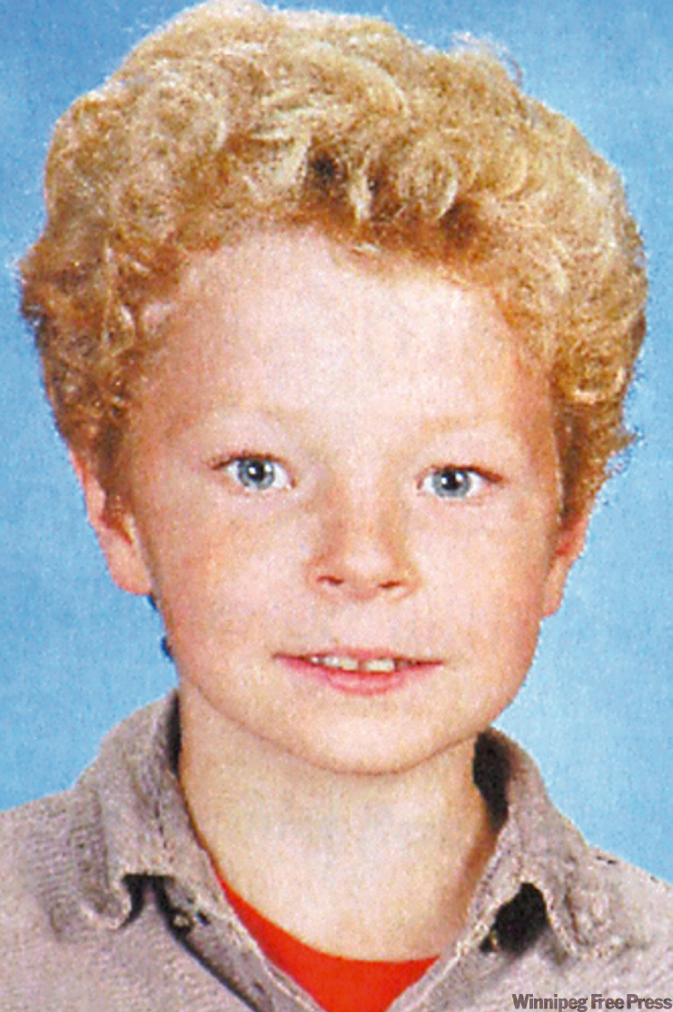 CP
FILE--Max Schoenborn, 8, is shown on a framed picture at the memorial wall in Merritt, B.C on Thursday April 10, 2008. The trial began Thursday for a father of three children found dead in their Merritt, B.C., home last year. Allan Schoenborn is accused of three counts of first-degree murder in the deaths of five-year-old Cordon, eight-year-old Max and their 10-year sister Kaitlynne Schoenborn. THE CANADIAN PRESS/Terry Theodore