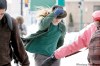 RUTH.BONNEVILLE@FREEPRESS.MB.CA 
Tom Hutchison-Hounsell keeps one hand on his hat while crossing Memorial Boulevard Monday afternoon during the blizzard.