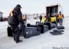 KEN GIGLIOTTI / WINNIPEG FREE PRESS archives
Crews deliver rolling garbage carts to northwest Winnipeggers last month. Allowing larger bins is still being debated by city.