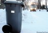 WAYNE.GLOWACKI@FREEPRESS.MB.CA 
An automated garbage truck picks up new trash carts in northwest Winnipeg.