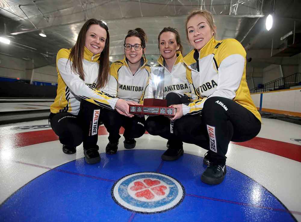TREVOR HAGAN / WINNIPEG FREE PRESS
Skip Tracy Fleury (from left), third Selena Njegovan, second Liz Fyfe and lead Kristin MacCuish show off their trophy after defeating Team Kerri Einarson in the Scotties final.