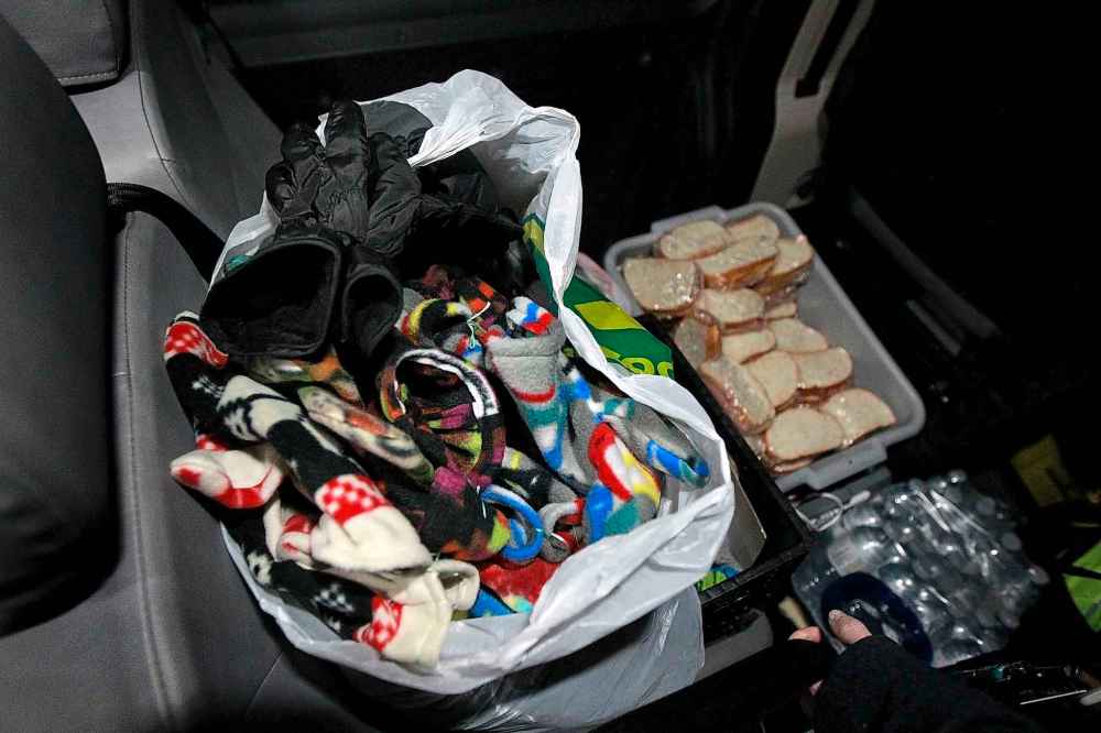 PHIL HOSSACK / WINNIPEG FREE PRESS
Bags full of fleece mittens and gloves sit in the back of the Main Street Project's Outreach Van to be given to homeless on the streets.