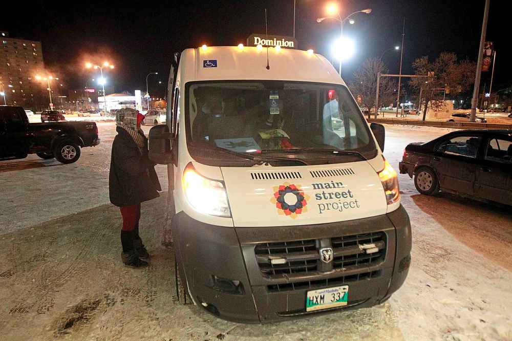 PHIL HOSSACK / WINNIPEG FREE PRESS
A woman living on the streets approaches the Main Street Project Outreach van Thursday night.