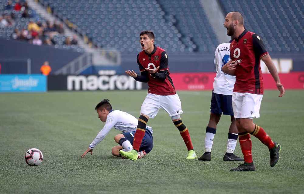TREVOR HAGAN / WINNIPEG FREE PRESS
Valour FC's Diego Gutierrez (left) and Stephen Hoyle (right) argue with an official before Gutierrez is shown a yellow card versus FC Edmonton, Saturday, May 4, 2019.