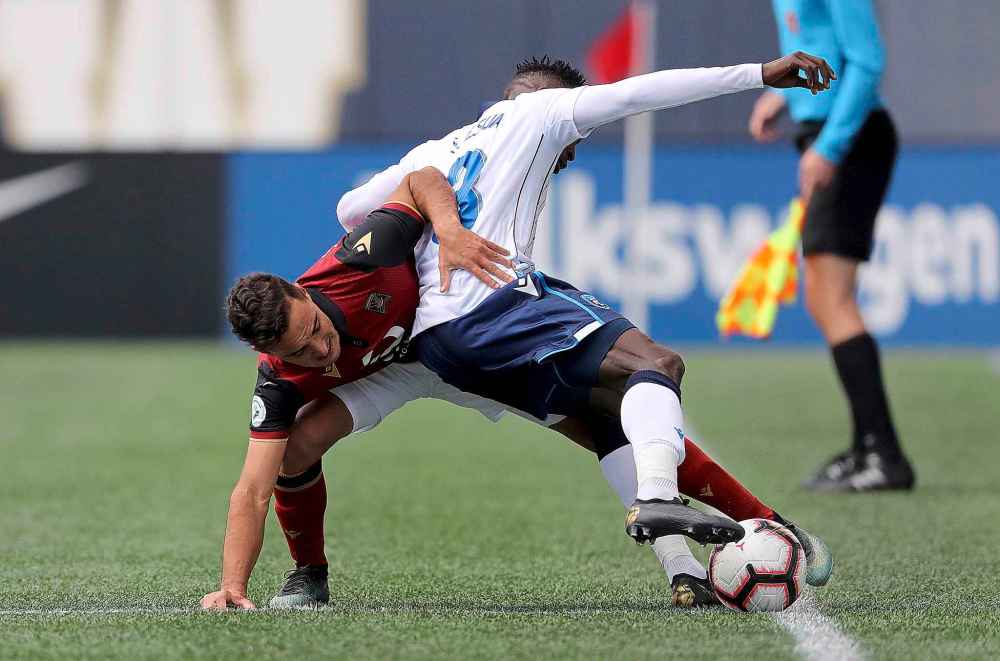 TREVOR HAGAN / WINNIPEG FREE PRESS
FC Edmonton Jeannot Esua (3) battles Valour FC's Martin Arguinarena, Saturday, May 4, 2019.
