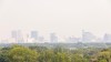 The hazy view of downtown Winnipeg from the top of Garbage Hill in Westview Park. Winds have blown smoke and ash from forest fires in northwestern Ontario into Manitoba. (SASHA SEFTER / WINNIPEG FREE PRESS)