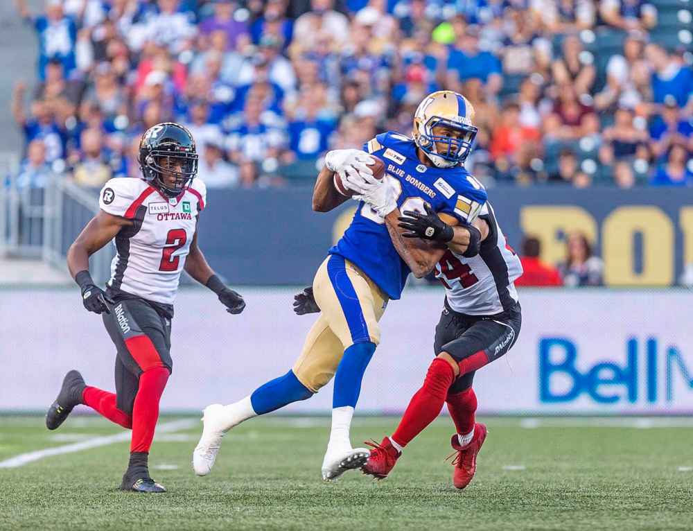 SASHA SEFTER / WINNIPEG FREE PRESS
Blue Bombers wide receiver Kenny Lawler breaks a tackle after catching a 54 yard pass from Matt Nichols for a touchdown against the Redblacks on Friday night.