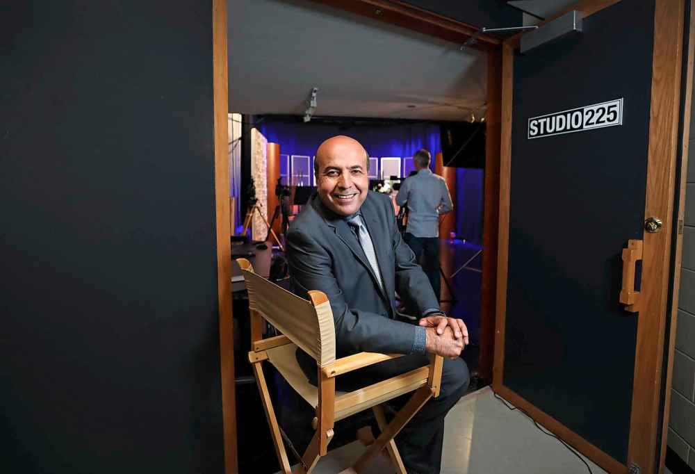 In addition to hosting his own show, one of the challenges on Shoaib Ebadi’s desk is transitioning support for the ministry, with an annual budget of $1.2 million, to a younger donor base. (Ruth Bonneville / Winnipeg Free Press)
