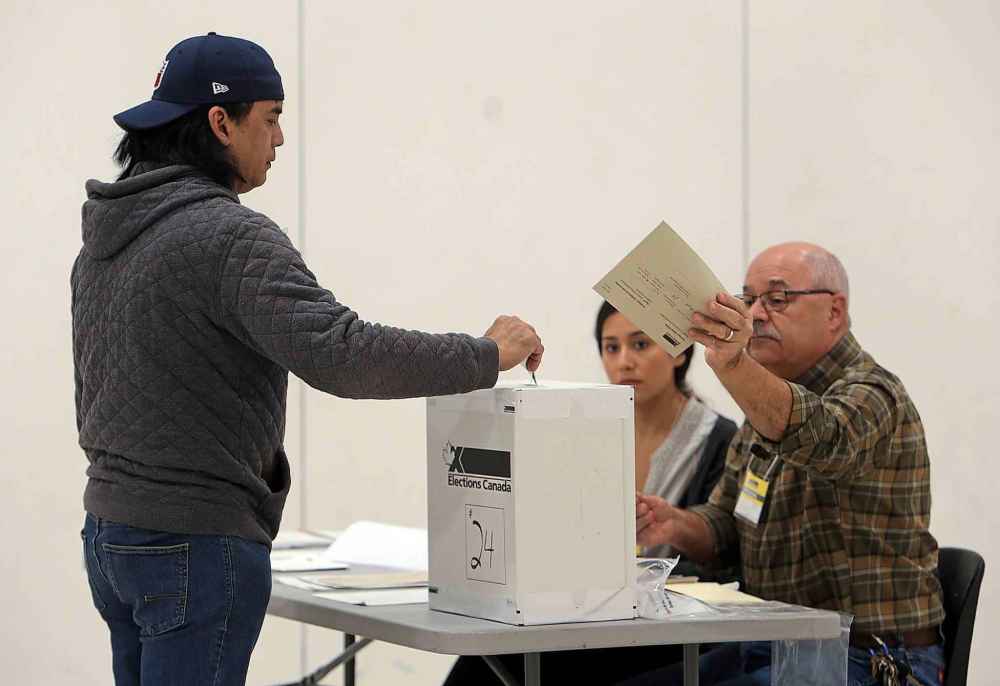 Fernando Garcia was at his pollsing station early to cast his ballot. Polling stations are open in Manitoba until 8:30 p.m. (Jason Halstead / Winnipeg Free Press)